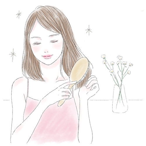 髪を梳かす女性